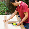 Mark Powers assembles the planter frame