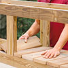 Mark Powers places the rest of the floorboards of the planter