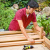 Mark Powers attaches the trellis slats