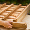 Mark Powers attaches the top trim of the trellis