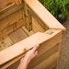 Mark Powers installs the planter/trellis front cap