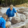 placing first stones for building a fieldstone wall