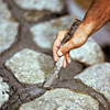 tooling the joints for building a fieldstone wall