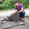 removing pieces of an asphalt driveway