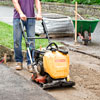 using a plate compactor to pack leveling sand
