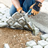 interlacing the cobblestone mats in the driveway apron