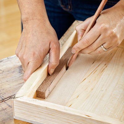 marking the inside of the box's base to attach to the base