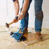 fastening the first wood slats of a herringbone floor with a flooring nailer
