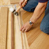 adding a walnut wood feature strip to a herringbone pattern floor