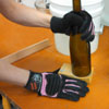 sanding the bottom of a wine bottle neatly broken off with a sanding block