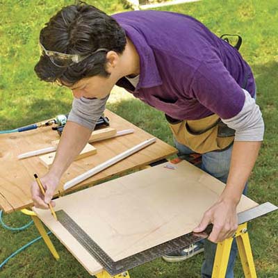 Using a framing square, draw two perpendicular lines on the plywood