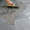 how to lay a stone-tile floor grout the joints