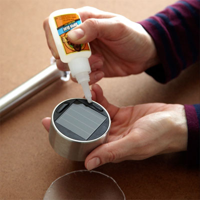 cut out the plexiglass circles to Make Solar Lanterns From Mason Jars