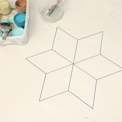 step by step how to paint a six-point star on wood floor, use ruler and permanent marker to outline diamonds