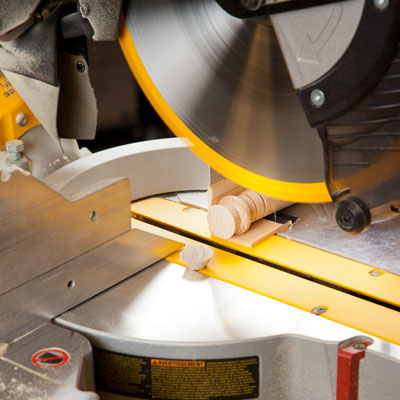trimming a table leg with a miter saw