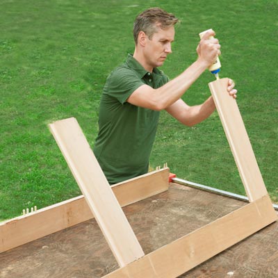 gluing rails into place for a picnic bench