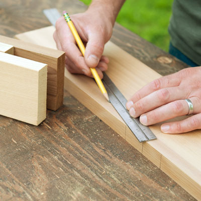 laying out the brackets and feet for a picnic bench