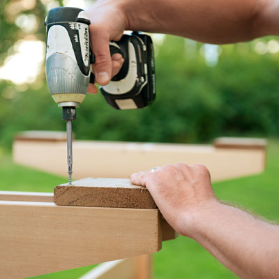 attaching the foot pads to the base for a picnic bench