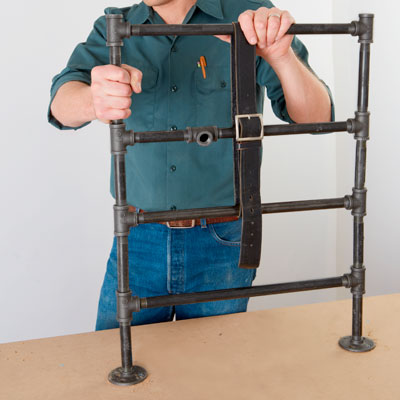 building the next rungs and looping a belt around them to hold them in place