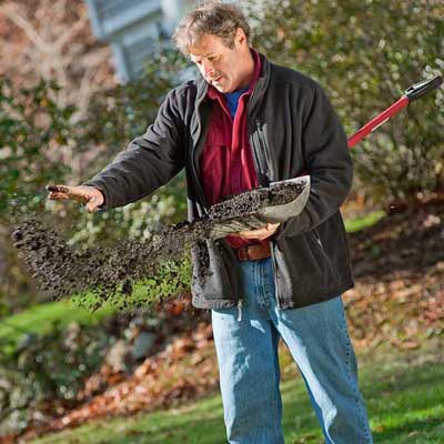 roger cook showing how to top-dress with compost and prepare your lawn for winter