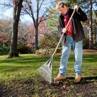 roger cook showing how to rake and water ro prepare your lawn for winter