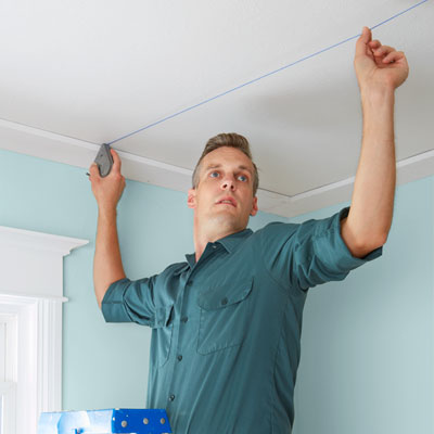 snapping a chalk line to get the main beam and crossbeam locations