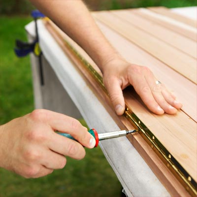 Secure the Seat Hinge to build a compost bench