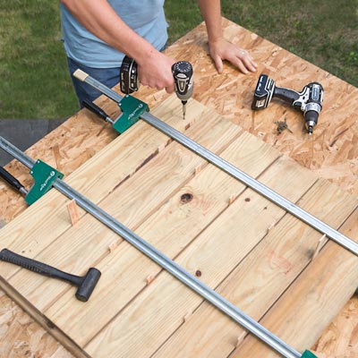 attaching floorboards to the stringers with a drill/driver