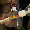 closeup of spring mechanism made from 2-liter bottle middle, zip ties, 1.5-in. PVC tubing and string