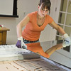 Adhere the mirror to the backer board with mirror mastic glue