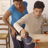 family sands the pieces of wood for building step stool