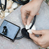 Step 1: Slip the bubbler's cord through slits cut into two rubber plugs