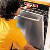 man fixing the dishwasher under the cabinet