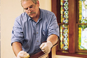 man waxing the wood