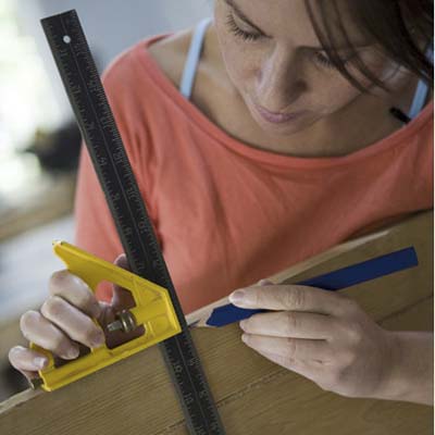 woman doing markings on shutters
