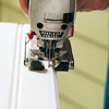 Sawing off a grooved edge.