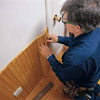 fitting wainscoting against door casing