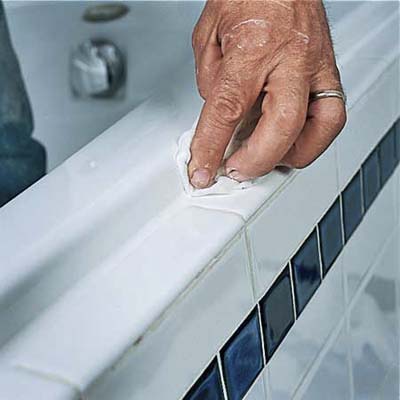 smooth the caulk with your finger and a damp rag