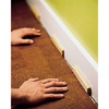 Inserting spacers along the wall.