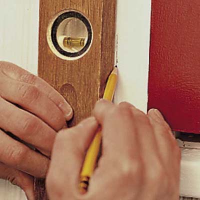 install the lower hinge pintles for exterior shutters