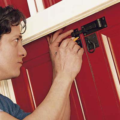 attach the locking hardware for the exterior shutter parts