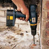 Drilling holes for lead anchors.