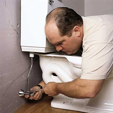 Richard Trethewey installing the toilet supply line