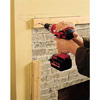 Boring the pilot holes with a hammer drill and carbide-tipped masonry bit.