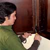 Reattach the cabinet door making sure not to bend the
hinges
