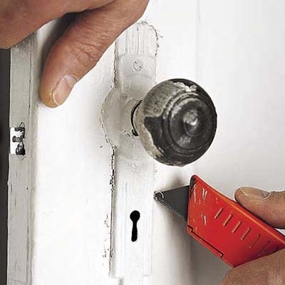 cut paint on door hardware with utility knife