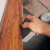 Dusting woodwork post sanding before painting a room 