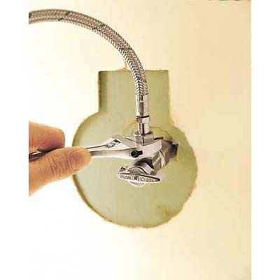 Connecting the water supply lines.