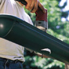 cutting downspout holes in a gutter