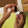 Removing the veneer trimmings.